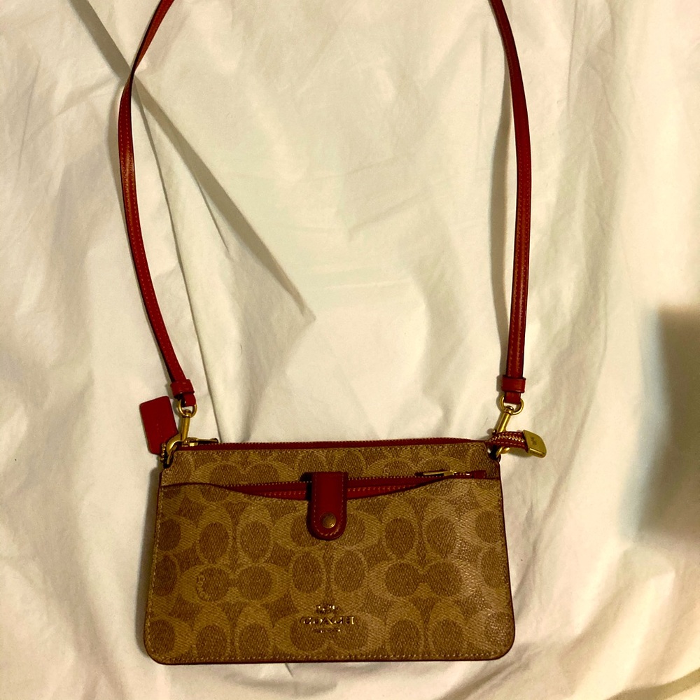 Beautiful Coach crossbody with pull out wallet.